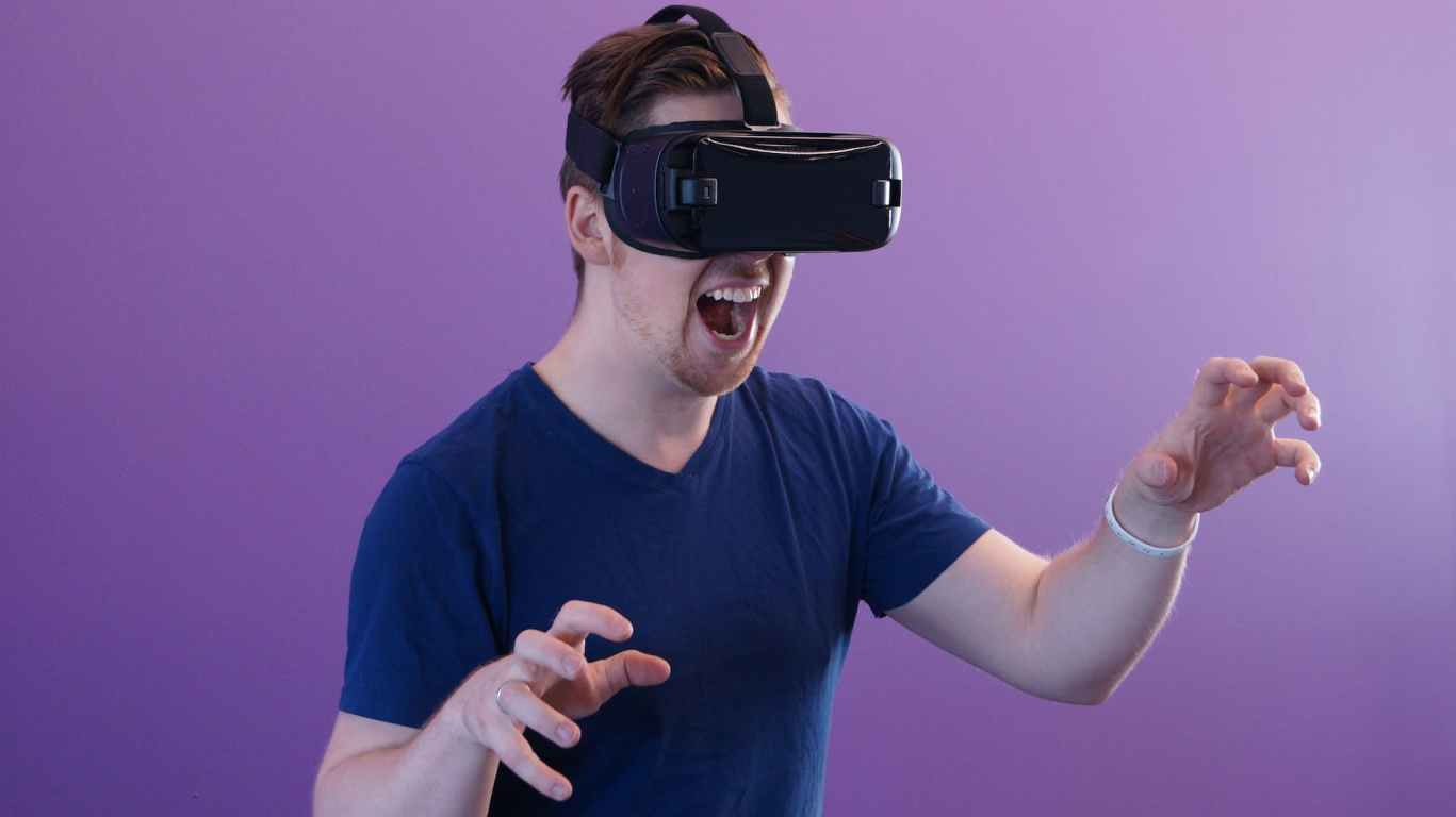 man wearing black virtual reality goggles